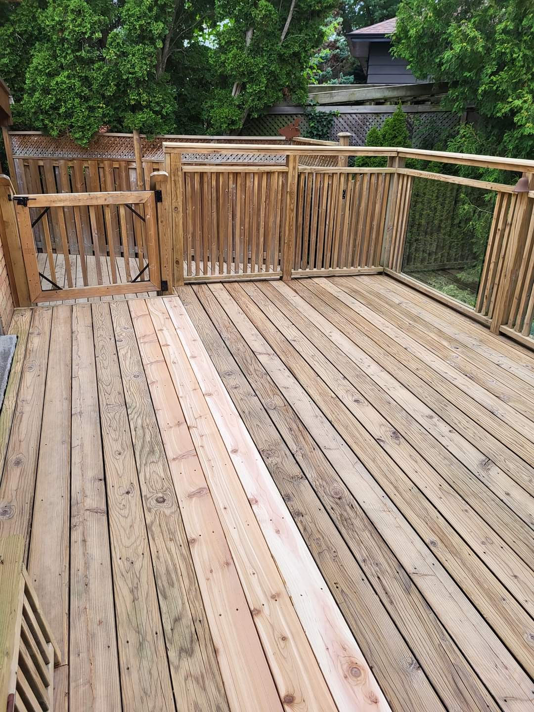 Burlington deck after washing, sanding and new cedar boards